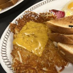 Waffle House - Cheese hash browns. 1 slice of American cheese