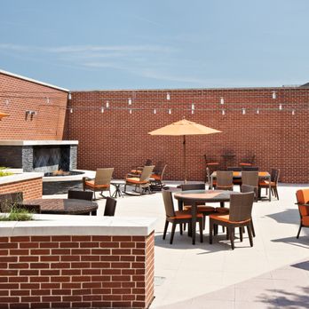 The Kingsley - Enjoy the courtyard by the warmth of the fireplace or conveniently cook at the grilling stations - Apartments Near Me - Alexandria, Virginia The Kingsley - Enjoy the courtyard by the warmth of the fireplace or conveniently cook at the grilling stations - Apartments Near Me - Alexandria, Virginia