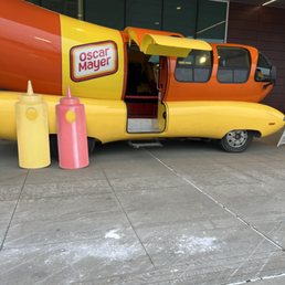 a yellow and orange hot dog truck