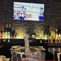 Wing Daddy's Sauce House - Bar top watching football.