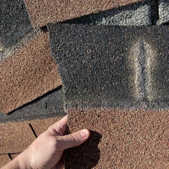 Raptor Roofing - Wind torn shingle. - Roofing Near Me Raptor Roofing - Wind torn shingle. - Roofing Near Me