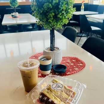 Chrusciki Bakery - Lemon Rasberry cake slice and caramel cinnamon  roll iced latte made with oat milk - Bakeries Near Me - Depew, New York