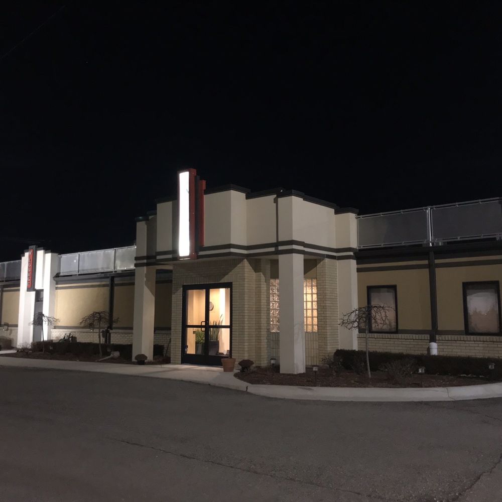 Infinity Hall/ Sidebar -  exterior at night - American Near Me - Fraser, Michigan