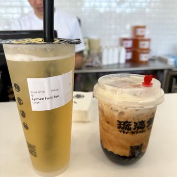 The Whale Tea - a plastic cup with a straw next to a plastic cup with a drink in it - Bubble Tea Near Me - Bayport, New York