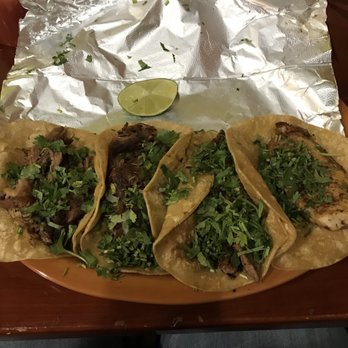 Villa del Rey cocina mexicana - From left to right: carnitas, carnitas, carne asada and pescado street tacos.  Magnificent! (I ordered mine without onions.) - New Mexican Cuisine Near Me - Mobile, Alabama