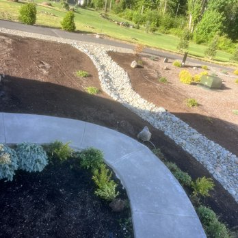 Schlappi Construction - Love the way Cody designed this for us where it flared out at the top. We have yet to install plants, bench, bird bath and solar lights - Excavation Services Near Me - Woodland, Washington Schlappi Construction - Love the way Cody designed this for us where it flared out at the top. We have yet to install plants, bench, bird bath and solar lights - Excavation Services Near Me - Woodland, Washington