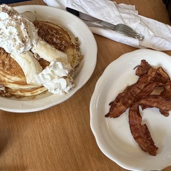 Dot Coffee Shop - Three buttermilk pancakes with bananas and pecans. Side of bacon. - American Near Me - Houston, Texas Dot Coffee Shop - Three buttermilk pancakes with bananas and pecans. Side of bacon. - American Near Me - Houston, Texas