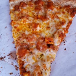 a slice of pizza on a piece of paper a slice of pizza on a piece of paper