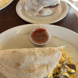a breakfast burrito and a breakfast sandwich a breakfast burrito and a breakfast sandwich