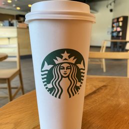 a starbucks cup on a table