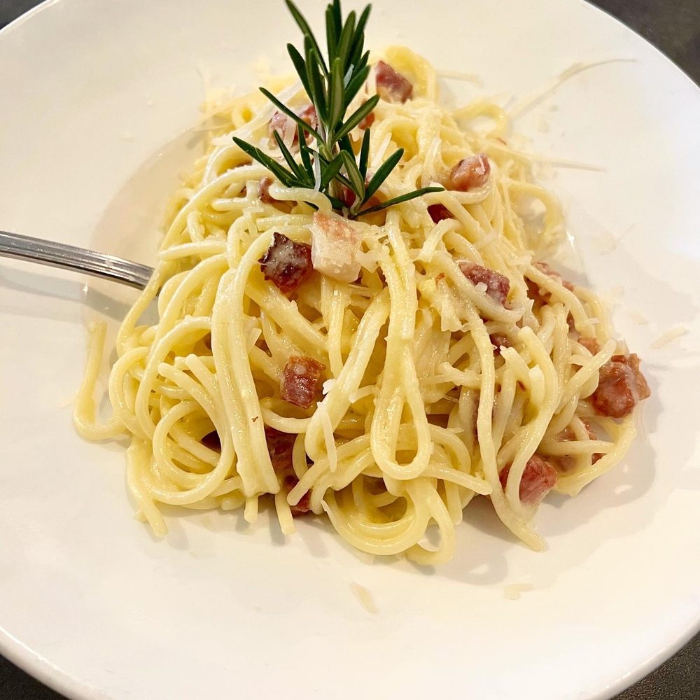 San Marco - a plate of pasta with a fork - Italian Near Me - Venice, Florida San Marco - a plate of pasta with a fork - Italian Near Me - Venice, Florida