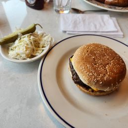 This is the cheeseburger I ordered medium well with a pickle slice and a small vat of coleslaw. This is the cheeseburger I ordered medium well with a pickle slice and a small vat of coleslaw.