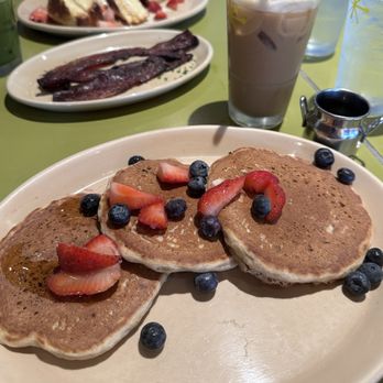 Snooze, an A.M. Eatery - Banana vegan pancakes, bacon, OMG French toast. Oat milk latte. - Breakfast & Brunch Near Me - Houston, Texas Snooze, an A.M. Eatery - Banana vegan pancakes, bacon, OMG French toast. Oat milk latte. - Breakfast & Brunch Near Me - Houston, Texas