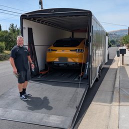 Driver John loading our car into his enclosed transport trailer. Driver John loading our car into his enclosed transport trailer.