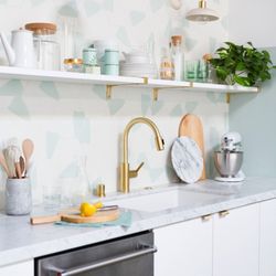 Designed backsplash with baby blue colors for a kitchen remodeling by GoodFellas Construction