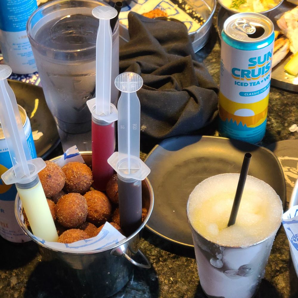 Topgolf - Spiked Tito's Mango Frozen Lemonade, Donut Holes - Golf Near Me - Cranston, Rhode Island Topgolf - Spiked Tito's Mango Frozen Lemonade, Donut Holes - Golf Near Me - Cranston, Rhode Island