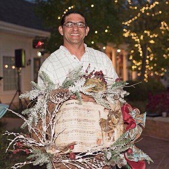 Serenity Landscape Lighting - a man holding a wreath - Landscaping Near Me - Ballwin, Missouri Serenity Landscape Lighting - a man holding a wreath - Landscaping Near Me - Ballwin, Missouri