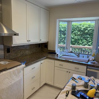 Meticulous painting - Finished cabinets reassembled in kitchen - Painters Near Me Meticulous painting - Finished cabinets reassembled in kitchen - Painters Near Me