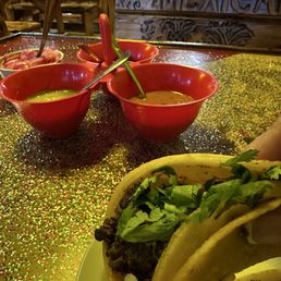 Delicious carne asada tacos ! Carful cause the hot sauces were crazy hot . Tasty but hot as hell! Delicious carne asada tacos ! Carful cause the hot sauces were crazy hot . Tasty but hot as hell!