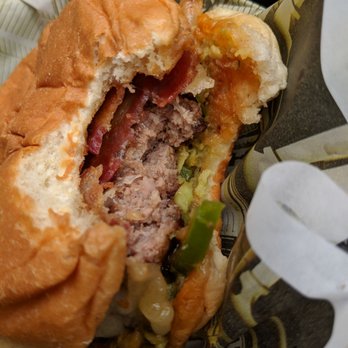 Wahlburgers - Wahlburger's BBQ Bacon Burger, served medium(?) - Burgers Near Me - Hingham, Massachusetts Wahlburgers - Wahlburger's BBQ Bacon Burger, served medium(?) - Burgers Near Me - Hingham, Massachusetts
