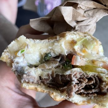 Charleys Cheesesteaks - Green bug at bottom of top bun. - Sandwiches Near Me - Modesto, California Charleys Cheesesteaks - Green bug at bottom of top bun. - Sandwiches Near Me - Modesto, California