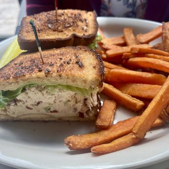 Homemade - Cranberry chicken salad with sliced apple, leaf lettuce, and white cheddar, on 12 grain bread with sweet potato fries. - Coffee & Tea Near Me - Fredericksburg, Virginia Homemade - Cranberry chicken salad with sliced apple, leaf lettuce, and white cheddar, on 12 grain bread with sweet potato fries. - Coffee & Tea Near Me - Fredericksburg, Virginia