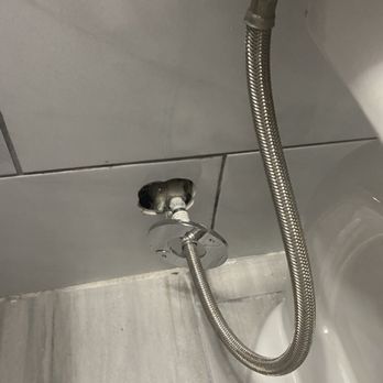 Missing Link Contracting - Shut off valve inside wall, loose cover. - General Contractors Near Me Missing Link Contracting - Shut off valve inside wall, loose cover. - General Contractors Near Me
