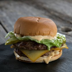 Big Smoke Burger - The Double Big! 2 AAA Alberta beef patties, smoked Canadian cheddar, lettuce, white onion, pickle and BIG sauce.