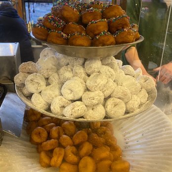 Daily Dozen Doughnut - Plain donuts that are used for the cinnamon donuts on the bottom, powered sugar in the middle and chocolate sprinkle on top - Bakeries Near Me - Seattle, Washington