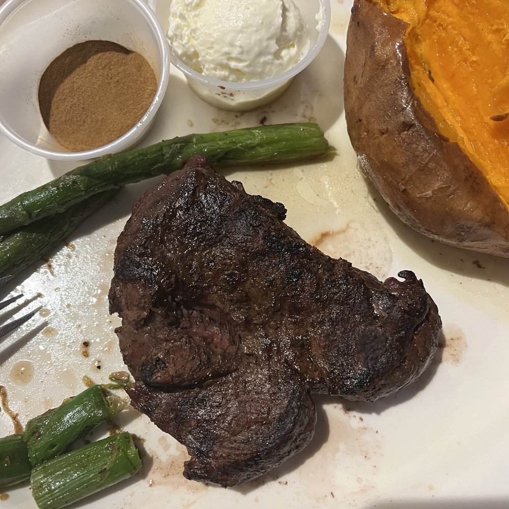 The Cutting Board - 8 oz Filet, mid rare, side of sweet potato and asparagus - Steakhouses Near Me - Burlington, North Carolina