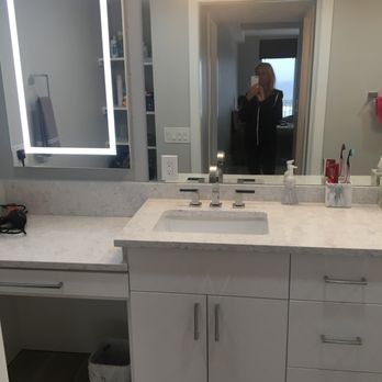 BPL Design Group - a woman taking a selfie in a bathroom mirror - General Contractors Near Me - Stuart, Florida