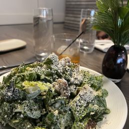 a white plate with a salad on it