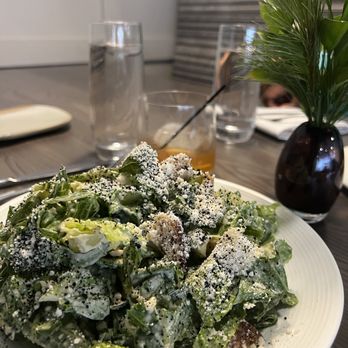 Grezi - a white plate with a salad on it - New American Near Me - Buffalo, New York