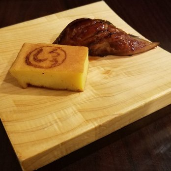 Shiro's - Omakase - last course. Eel + a Tamago with Shiro logo. How cute - Sushi Bars Near Me - Seattle, Washington