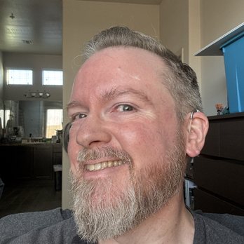 Mission Barbers - After photo of men's short gray haircut and full beard trim by Dominick at Mission Barbers (Gilbert, AZ) showing clean lines and sharp edges - Barbers Near Me - Chandler, Arizona