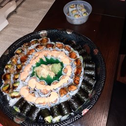 a plate of sushi and rolls a plate of sushi and rolls