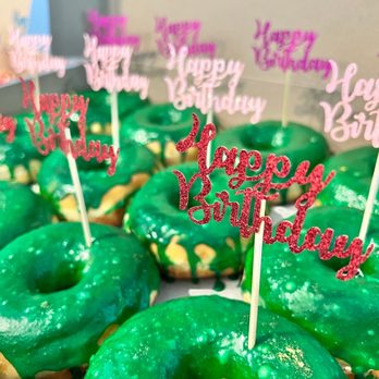 Rainbow Donuts - Matcha Green Tea donuts (birthday flags added by me) - Donuts Near Me - Phoenix, Arizona