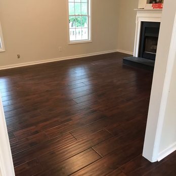 Astonishing Flooring - a living room with hardwood floors - Flooring Near Me Astonishing Flooring - a living room with hardwood floors - Flooring Near Me