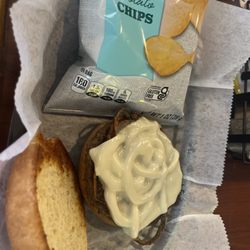Cheeks Bar & Grill - Cheeseburger with Swiss cheese and grilled onions and chips. Delicious.