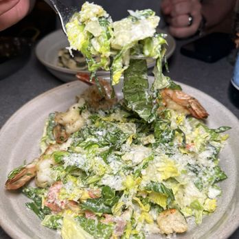 Lulla - grilled shrimp Caesar salad with gem lettuce, roasted tomato, pecorino romano, and Caesar dressing. - Italian Near Me - New York, New York Lulla - grilled shrimp Caesar salad with gem lettuce, roasted tomato, pecorino romano, and Caesar dressing. - Italian Near Me - New York, New York
