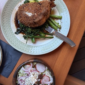 Madison - Pork chop and side Greek salad - Italian Near Me - San Diego, California Madison - Pork chop and side Greek salad - Italian Near Me - San Diego, California