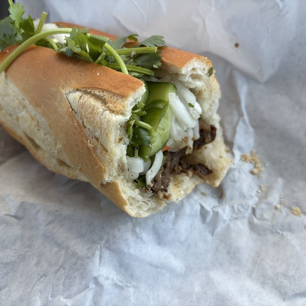 Half of no. 1 grilled pork Banh Mi, they ask if you want it cut in half Half of no. 1 grilled pork Banh Mi, they ask if you want it cut in half