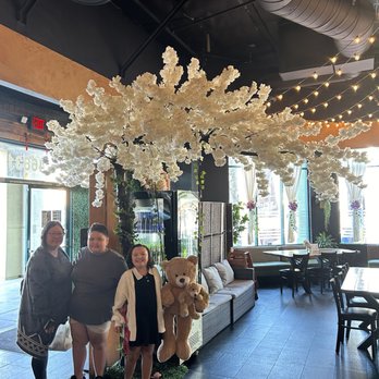 Amazing Basil - Entrance with floral wall, swing and flowers - Asian Fusion Near Me - Fremont, California Amazing Basil - Entrance with floral wall, swing and flowers - Asian Fusion Near Me - Fremont, California