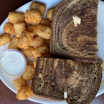 McMenamins John Barleycorns - Chicken Schneuben Sandwich:breaded chicken schnitzel with sauerkraut relish and Swiss cheese. Cajun tots - Pubs Near Me - Tigard, Oregon McMenamins John Barleycorns - Chicken Schneuben Sandwich:breaded chicken schnitzel with sauerkraut relish and Swiss cheese. Cajun tots - Pubs Near Me - Tigard, Oregon