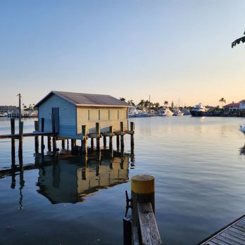 Cap's Place Island Restaurant - a dock with a boathouse - Seafood Near Me - Lighthouse Point, Florida