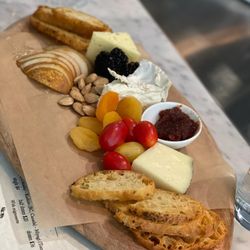 Trillium Winebar & Taproom - Cheese tasting board includes fruit, nuts, and preserves.