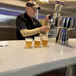 Our tour guide getting our first round of beers ready. Our tour guide getting our first round of beers ready.