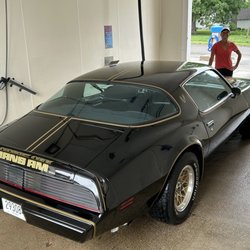 Shining her ride at Lenexa Classic Car Wash