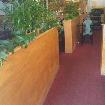 Tea Pot Chinese Restaurant - Main seating area separated from the front by a low wall and plants. - Chinese Near Me - Cayce, South Carolina