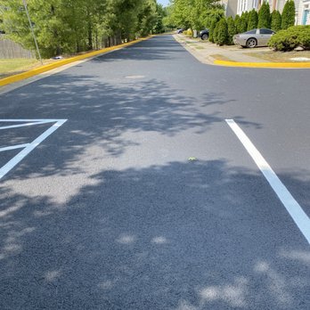 T.H.C. Asphalt and Clean-Up - ows a residential street with parking spaces - General Contractors Near Me T.H.C. Asphalt and Clean-Up - ows a residential street with parking spaces - General Contractors Near Me